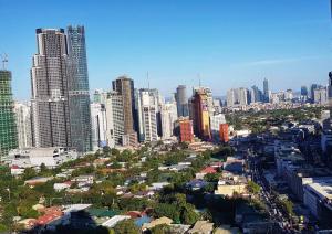 a view of a city with tall buildings at HOMEY MAKATI CONDO UNIT with NETFLIX in Manila