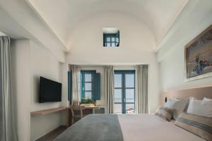 Postel nebo postele na pokoji v ubytování Aeifos Boutique Hotel