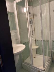 a bathroom with a shower and a sink and a toilet at ХОТЕЛ ВИЛА Мая in Pleven +9 photos