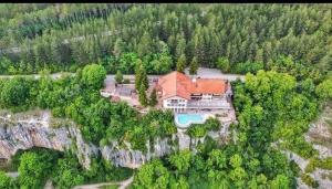 an aerial view of a house on a cliff at ХОТЕЛ ВИЛА Мая in Pleven