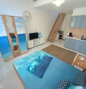 a living room with a pool in the middle of a room at Apartament Pescăruș in Schitul