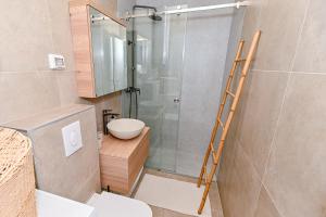 a bathroom with a shower and a toilet and a ladder at Sea Whisper apartment Zadar in Zadar +25 photos