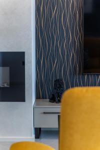 a stuffed animal sitting on a table next to a wall at Vila Aris in Kostrena