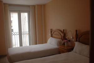 Postel nebo postele na pokoji v ubytování Hotel Flor de Sal
