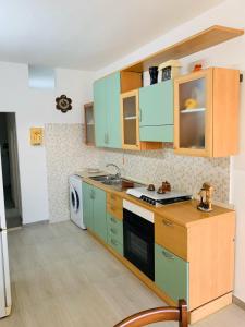 Kuchyň nebo kuchyňský kout v ubytování Casa Mariangela