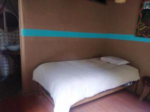 Postel nebo postele na pokoji v ubytování Salkantay Hostel Chaullay