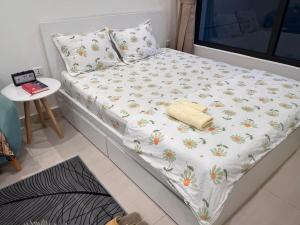 Ένα ή περισσότερα κρεβάτια σε δωμάτιο στο Vinhome Grand Park Staycation