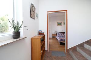 Ένα ή περισσότερα κρεβάτια σε δωμάτιο στο Apartments and rooms Kruna