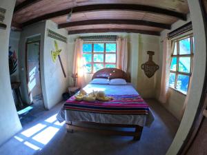 Postel nebo postele na pokoji v ubytování Salkantay Hostel Chaullay