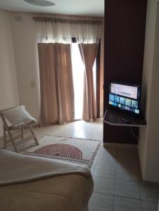 TV a/nebo společenská místnost v ubytování Ideal Place con cochera techada + 19 fotografií