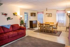 a living room with a couch and a table at Maple Hide A Way in Hammondsport