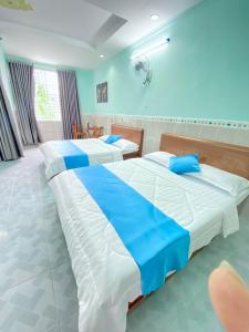 Postel nebo postele na pokoji v ubytování Phú Mỹ Port Motel