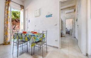 a dining room with a table and chairs at Awesome Apartment In Casarza Ligure in Casarza Ligure