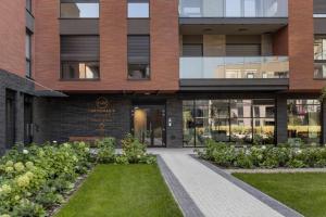 Vonkajšia záhrada v ubytovaní Apartament Nadmotławie 34