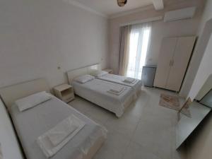 Postel nebo postele na pokoji v ubytování Hotel NUCA