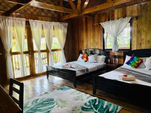 Voodi või voodid majutusasutuse White Beach Front and Cottages toas