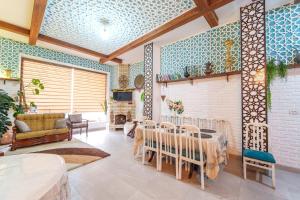 a dining room with a table and chairs at Hotel Anor in Samarkand