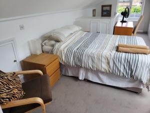 Katil atau katil-katil dalam bilik di Avalon Guest Suite Ewell