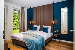 Ένα ή περισσότερα κρεβάτια σε δωμάτιο στο Recreatiewoning 'Steenpatrijs' op Christelijk Vakantiepark +59 φωτογραφίες