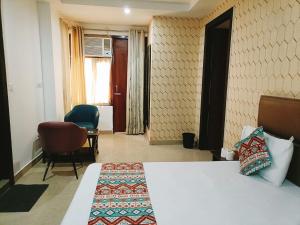 Postel nebo postele na pokoji v ubytování Hotel Tela Suite Near IGI Airport Delhi