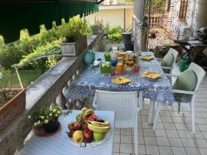 a table with a bunch of fruit on it at Villa Gabriella B&B - Apartments in Venice-Lido