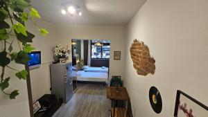 a room with a bedroom with a bed and a television at UnionBNB Apartments in Tirana +25 photos
