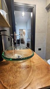 a water fountain on top of a wooden table at UnionBNB Apartments in Tirana