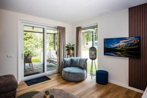 Χώρος καθιστικού στο Recreatiewoning 'Dwergarend' op Christelijk Vakantiepark
