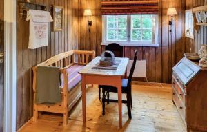 a kitchen with a table and a bed in a room at Månebu in Tunhovd +11 photos