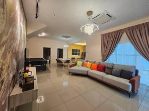 a living room with a couch and a pool table at jia Residence 21 pax Karaoke & Snooker in Ipoh
