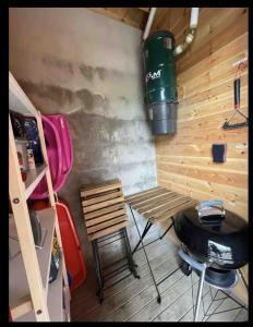 a room with a table and a grill and a chair at Storsten 725C in Trysil +11 photos
