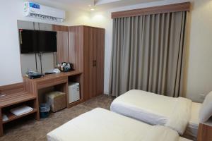 Postel nebo postele na pokoji v ubytování Buyot Malath Serviced Apartment - شقق بيوت ملاذ للشقق المخدومة