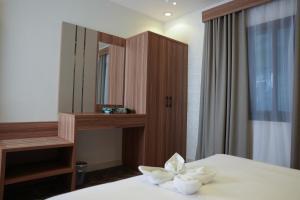 Postel nebo postele na pokoji v ubytování Buyot Malath Serviced Apartment - شقق بيوت ملاذ للشقق المخدومة