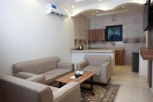 Posezení v ubytování Buyot Malath Serviced Apartment - شقق بيوت ملاذ للشقق المخدومة