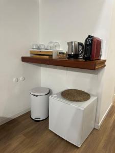 a room with a counter with a toaster and a shelf at Testa house downtown in Sorrento