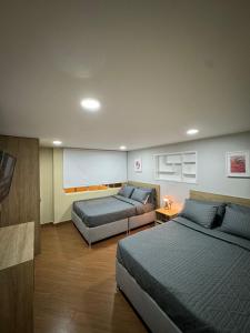 Postelja oz. postelje v sobi nastanitve Hostelfc Usaquen