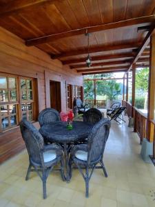 a dining room with a table and chairs at Private Lodge Sierra Nevada de Santa Marta in Santa Marta