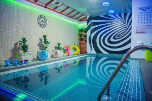 a swimming pool in a room with a swimming pool at HS Miracle Grand in Hulhumale