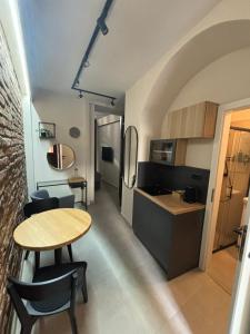 a kitchen and dining room with a table and chairs at City room Zagreb in Zagreb