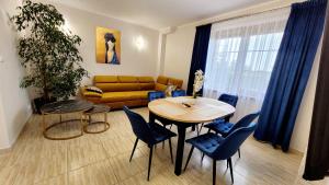 a living room with a table and a couch at Gościniec Krys in Żnin