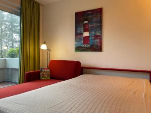 Postel nebo postele na pokoji v ubytování Meeresrauschen 16, Olhörnweg