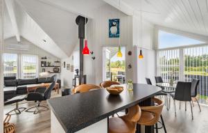 a kitchen and dining room with a table and chairs at Nice Home In Hemmet With Wifi in Hemmet