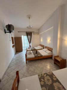 Postel nebo postele na pokoji v ubytování Hotel Katia + 6 fotografií