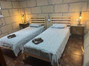 Postel nebo postele na pokoji v ubytování Abona Cave House