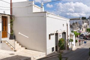 a white building on the side of a street at Suite B26 in Alberobello