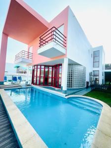 a house with a swimming pool in front of it at Vila D'Alba - Sem Stress in Albufeira