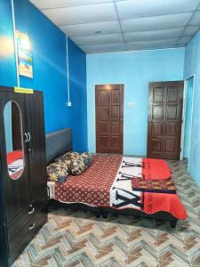Postel nebo postele na pokoji v ubytování SR Kampar Homestay, Bandar Baru Kampar
