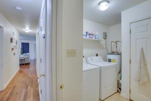 a white laundry room with a washer and dryer at Less Than 3 Mi to French Quarter Pet-Friendly Home in New Orleans +17 photos