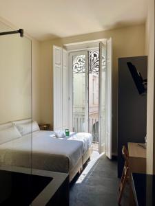 Postel nebo postele na pokoji v ubytování Cosy Rooms Tapinería