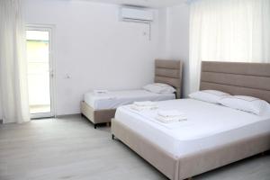 Postel nebo postele na pokoji v ubytování Vila Jovani + 25 fotografií